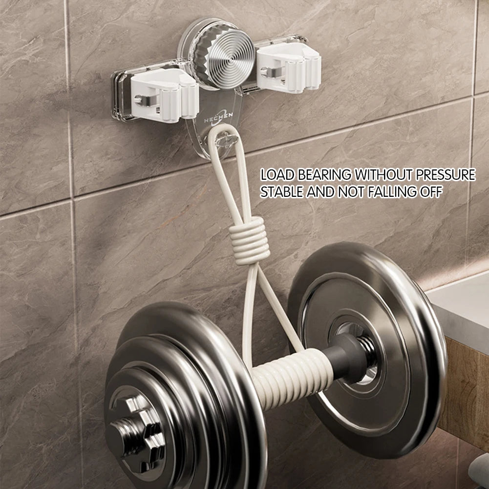 Wall-mounted broom holder organising multiple cleaning tools in laundry room