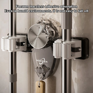 Adhesive wall mount mop and broom holder gripping cleaning equipment securely